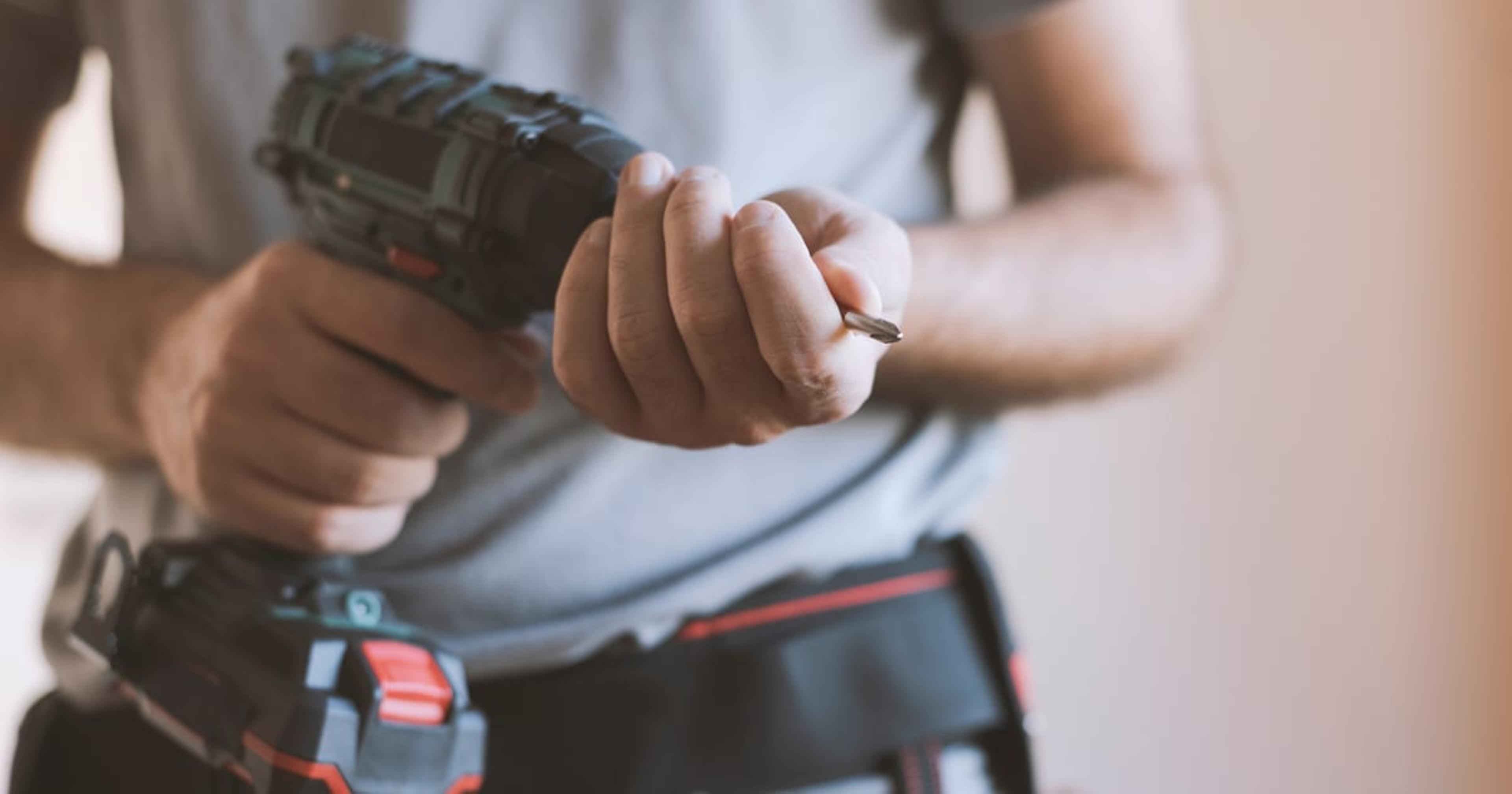 man with a power drill